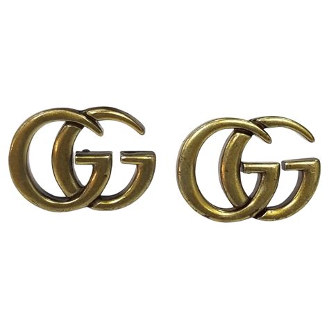 gucci gold logo studs|images of Gucci logo.